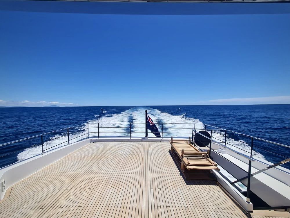 Open water off the aft deck of a motor yacht at cruising speed